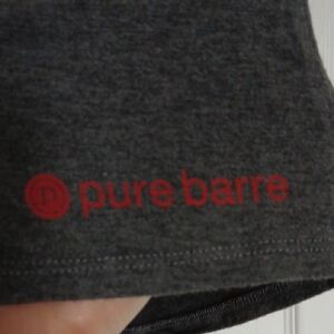 Set of two Pure Barre tanks.
